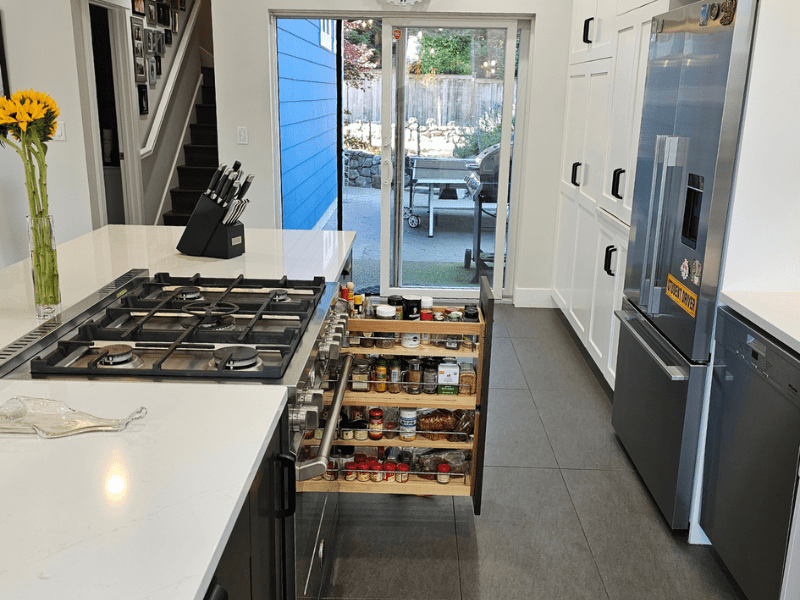 Kitchen with pull-out pantry storage and patio access